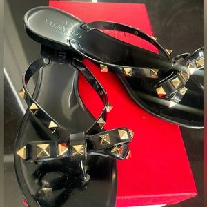 Black Valentino bow sandals with gold hardware
